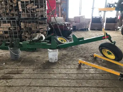 Pair of JOHN DEERE LIFT ASSIST WHEELS complete with cylinders and all mounting hardware, $850 Pickup...