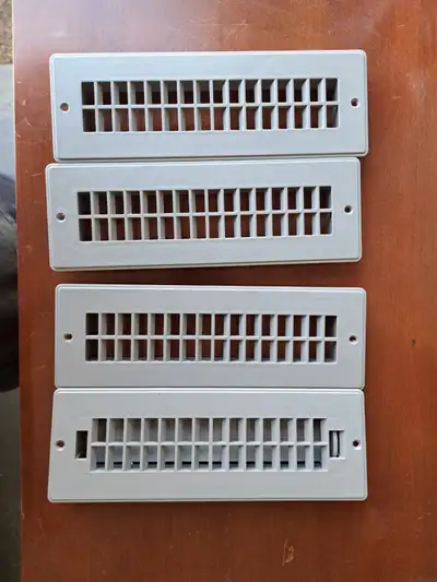 I have 4 brand new RV floor registers. 1 is dampered and the rest are not. Fits hole 2 1/4" x 9 7/8"...