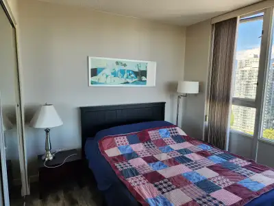 Room for rent in a luxury waterfront condo in Yaletown. Building amenities include a gym, pool, saun...