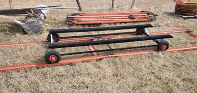 2 ,90 foot rails bolt together . with 4 cross members . 1 boat bunk on wheels . 3 double rollers, 3...