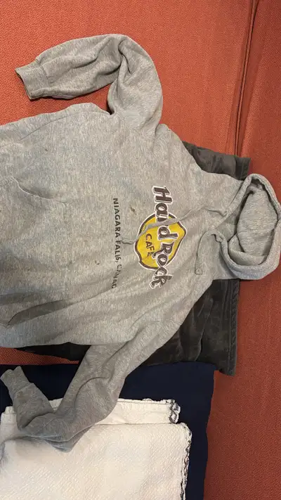 Grey Hard Rock Cafe hoodie from Niagara Falls, Canada. Size Medium. Pre-owned with visible stains on...
