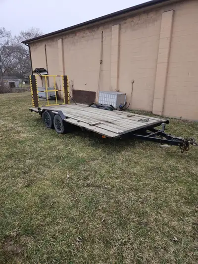 16 foot flat deck trailer. 7 1/2 feet wide Trailer it's solid 2in ball hitch. Does needs new lights...