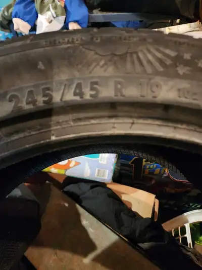 Offering a pair of winter tires, size 245/45R19, perfect for providing enhanced grip and safety duri...