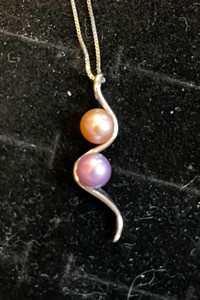 Real Akoya pearls set in sterling, silver setting with necklace