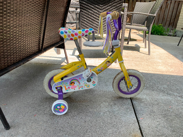 Dora bicycle with training wheels in Kids in Markham / York Region