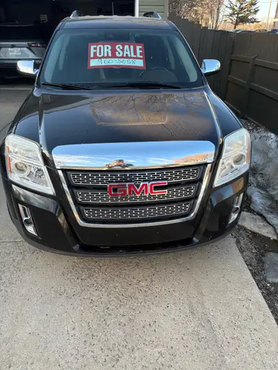 This is a used 2013 GMC Terrain SLT, a versatile SUV perfect for families or anyone needing extra sp...