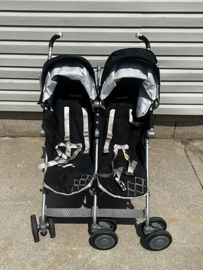 Selling a used Maclaren Twin Triumph double stroller, perfect for navigating city streets with two l...
