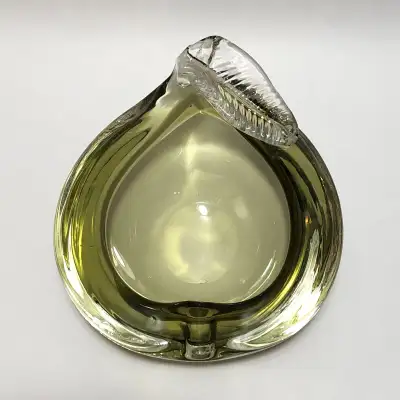For sale is a vintage Chalet pale green and clear art glass cigar ashtray in the form of a pear, lea...
