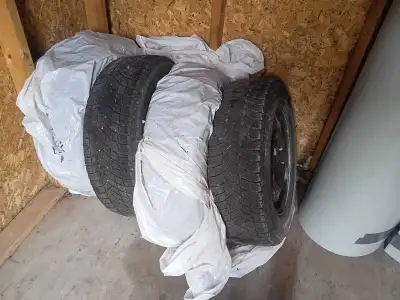 Complete set of winter tires and rims, 215/70/R16 Enough tread for 1 winter at least. $150 takes the...