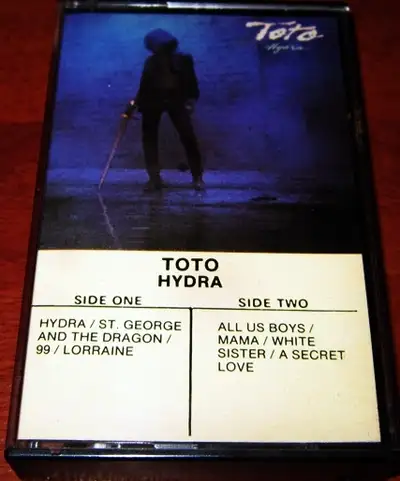 Cassette Tape :: Toto – Hydra $5 Dollars A1 Hydra A2 St. George And The Dragon A3 99 A4 Lorraine B1...
