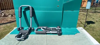 2 sets of folding J Kayak Carriers All the hardware required to attach each carrier to vehicle roof...