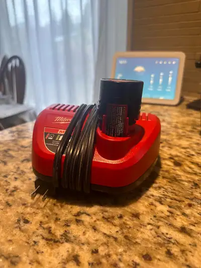 Milwaukee M12 battery and charger , View more