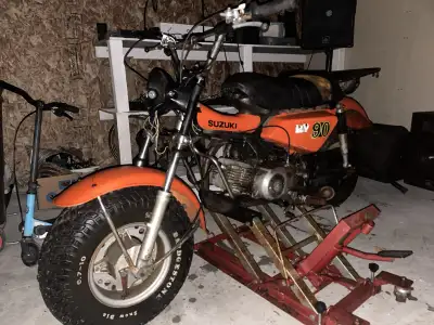 This is a Suzuki RV 90 from the 1980s, a vintage find perfect for collectors or enthusiasts. This bi...