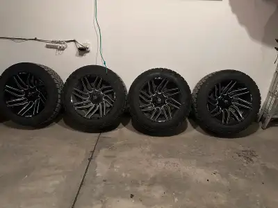 Fuel Typhoon 22x12 wheels. -44 offset. Dual bolt pattern 5X114.3/5X127 Toyo Open Country AT3 tires s...