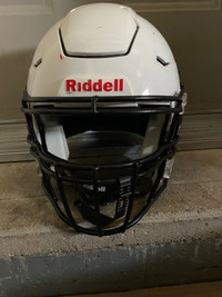 Football helmet (sold) , pads, and duffel bag 