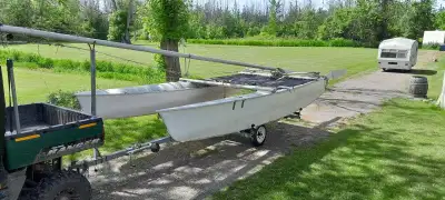 Older sailboat, some wear and tear. Comes with two sails, main and jib, plus numerous extra parts. T...