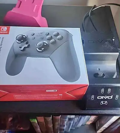 Nintendo Switch Pro Controller + charge dock like new, View more