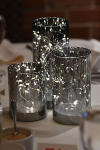 Silver hurricane vases with LED lights