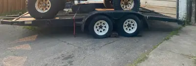 Selling a used tandem axle trailer that's ready to haul your equipment or toys. It's sturdy and reli...