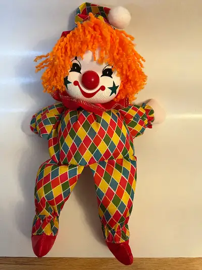 - clean and no mark - clown musical doll with moving head - approx 8” tall sitting