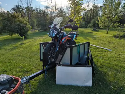 4x5 Foot box trailer will hold one yard of soil/ gravel Tilts to assist in unloading . Front panel u...