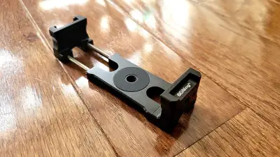 BRAND NEW Universal Smartphone Holder/Tripod Mount Clamp, View more