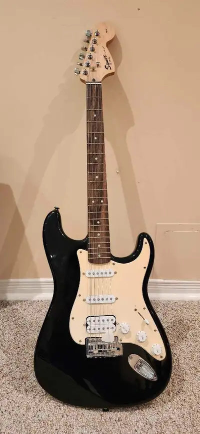 FENDER SQUIRE AFFINITY WITH VINTAGE PICK GUARD PLAYS BEAUTIFULLY COMES WITH WASHBURN BAD DOG AMP AND...