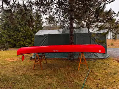 Red Old Town Discovery 169 canoe for sale. Never used and still has the original stickers on it. Thi...