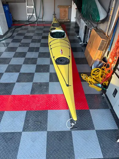 This kayak is fiberglass and weighs 49 lbs. Excelent condition . Has controllable rudder. Comfortabl...