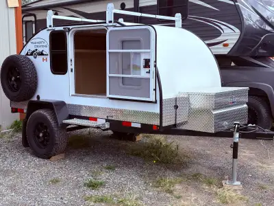 Brand new teardrop camper. C/W brakes, queen bed, 12 volt electrical system, extra clearance, jeep w...