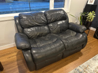 Two reclining leather loveseats 