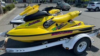 1997 SeaDoo XP and 1998 SeaDoo SPX on a modified EZ Loader Boat trailer. Second owners, low hours. B...