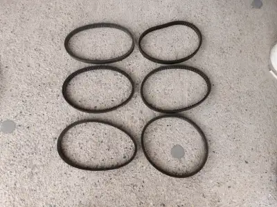Several used snowmobile belts. Bombardier p/n 570-0411-00 & p/n 570-414. ,,Power__?__ p/n PBX-13530,...