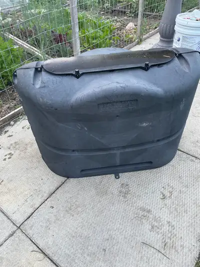 This is a used, heavy-duty RV propane tank cover that's ready to protect your propane tank from the...
