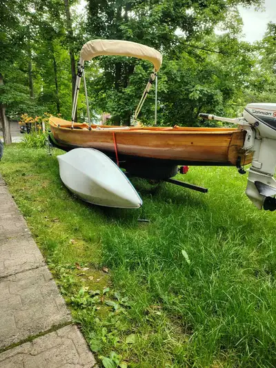 Cedar strip freighter canoe and custom trailer, no motor, rated for 10hp, 9.9hp will reach around 25...