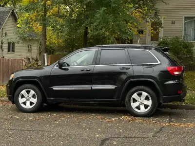 2011 Grand Cherokee Larado for sale. Needs some repairs to exhaust system, a/c, and rear back displa...