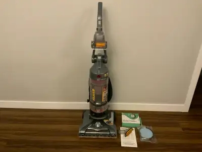 Hoover Windtunnel T Series vacuum cleaner. Also includes 2 new filters. Bagless vacuum. It is a loud...
