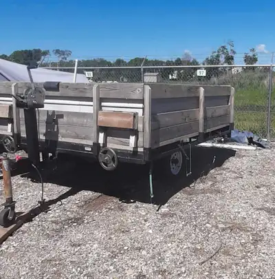 This is a used 6'8" x 8' tilt trailer, perfect for various hauling needs. The trailer features a stu...