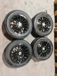 RSS rims with Uniroyal Tiger Paw Touring All Season tires