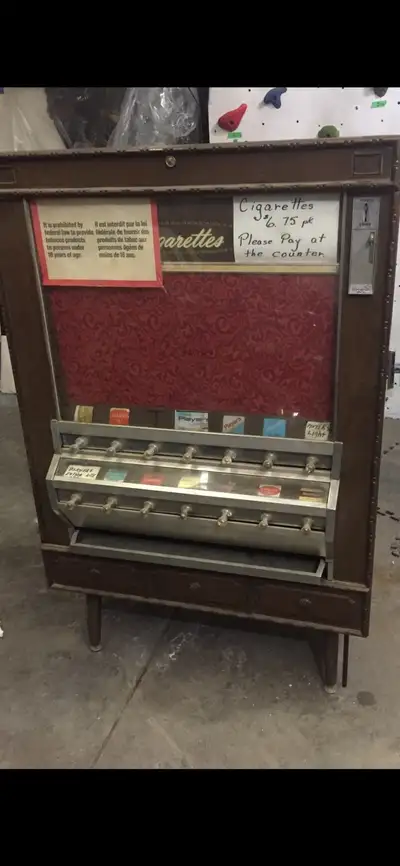Vintage cigarette vending machine. Could make an awesome liquor cabinet! Or a cool cabinet/feature i...