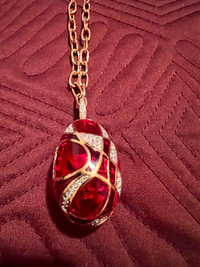 Gold necklace with egg pendant