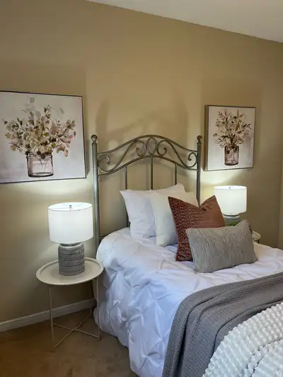 Iron twin bed with mattress, boxspring, and mattress topper., View more