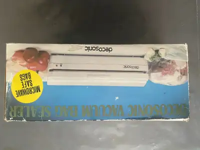 This is a Decosonic Vacuum Bag Sealer, designed to remove air and seal bags to keep food fresh longe...