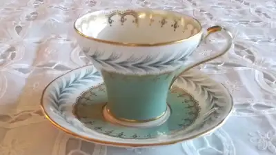 FINE BONE CHINA CUP AND SAUCER - AYNSLE, ENGLAND CORSET SHAPED. JADE GREEN , BLACK AND WHITE WITH GO...