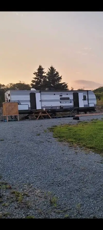 Asking $44,000. Immaculate camper. 2 slides. HUGE bunkhouse (3 wide bunks and 1 convertible sofabed...