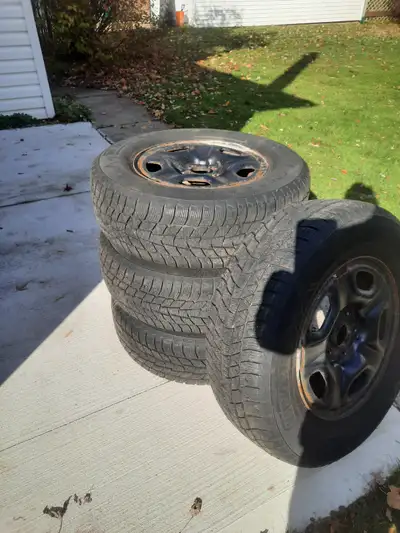 2014 tacoma base 2 wheel drive 15" rims with tires for sale.Lots of tread left. $250.00 obo Woodstoc...