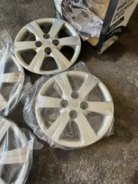 Hyundai Accent hubcaps and  tires 185/70R14