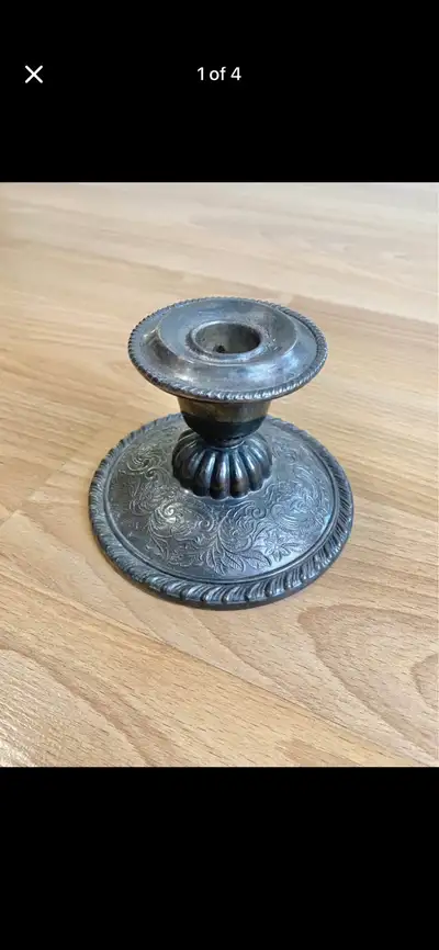 Vintage, William A. Rogers silver plated candle stick that’s 3.5 inches tall and 4.75 inches in diam...