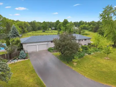 Welcome to 7648 Wellington Rd 34 – a countryside retreat with resort-style backyard and stylish, mod...
