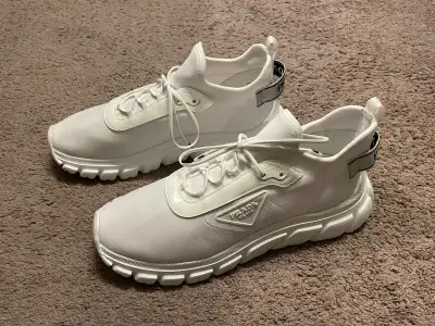 Brand new never worn Prada white sneakers. Original price $1350. I got them as gifts but they are wa...